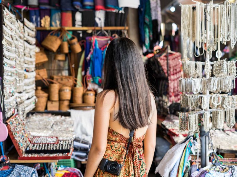 young-woman-traveler-at-ubud-market-in-bali-2023-11-27-04-50-10-utc